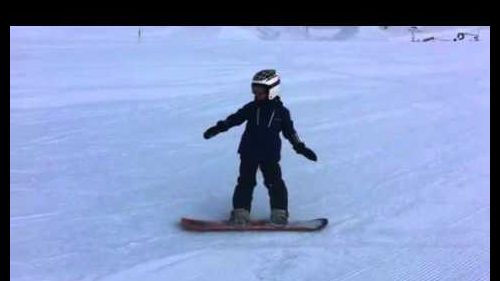 5 Year old boy doing snowboard