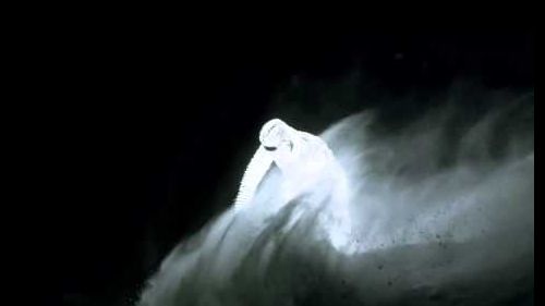 Led-covered snowboarder lights up the french alps