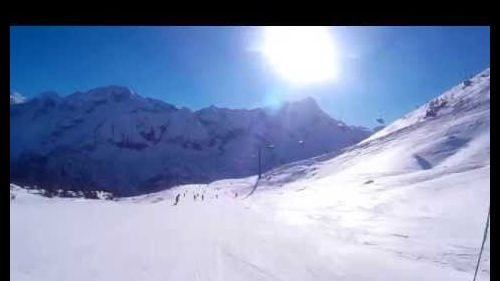 Skiing down the Viabola slope, Passo Tonale, Italy