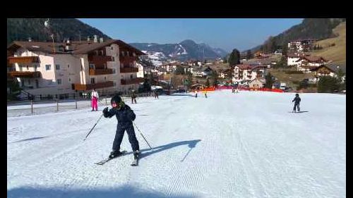 Kids skiing backwards